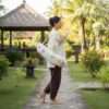 a woman carrying hemp yoga mat cover from the side in a retreat centre
