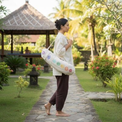 a woman carrying hemp yoga mat cover from the side in a retreat centre