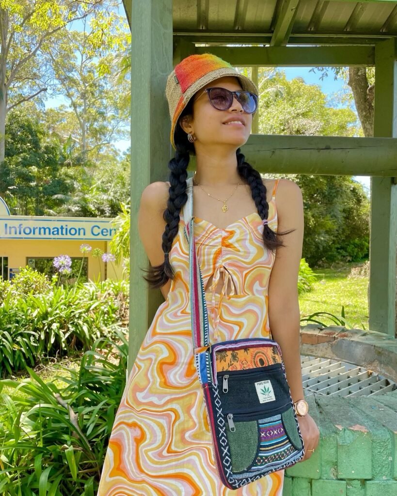 Model wearing a Hemp bucket hat and a side bag