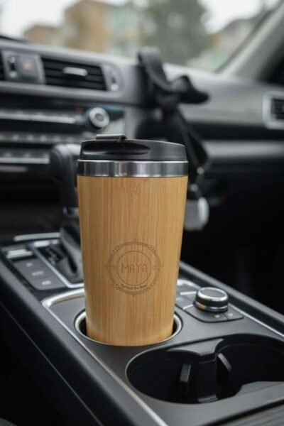 bamboo tumbler placed in a car cup holder