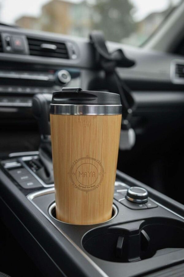 bamboo tumbler placed in a car cup holder