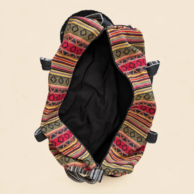 Inside of Colorful and Vibrant Duffle Bag showing woven textile texture, side pocket and strap hardware