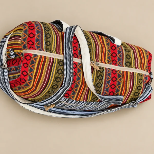 Close-up of Colorful and Vibrant Duffle Bag showing woven textile texture, side pocket and strap hardware
