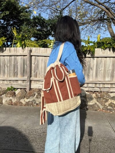 Women carrying Brown TerraTrek hemp backpack