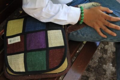 close up view of vibrant hemp side bag by spread Maya