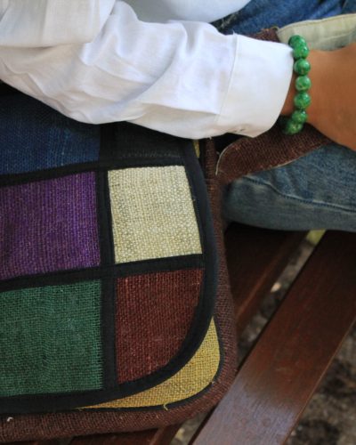 close up view of vibrant hemp side bag by spread Maya