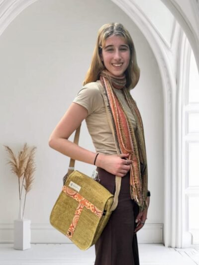 model wearing a Tribal Harmony cross body bag, mustard color, Hand-made in Nepal