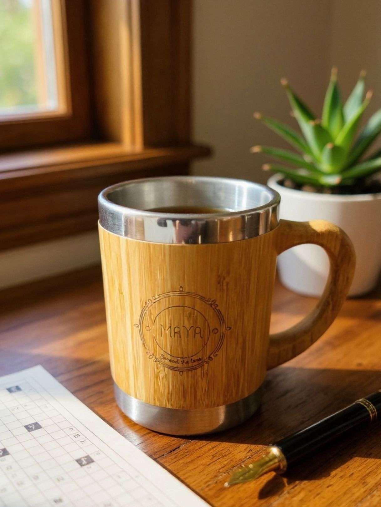 bamboo coffee mug with handle on a table by spreadmaya