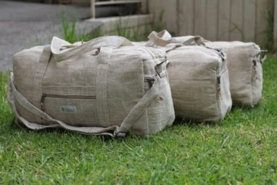 different sizes natural hemp duffle bag on grass