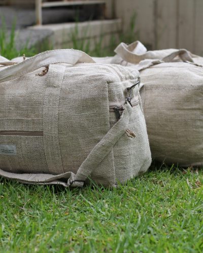 different sizes natural hemp duffle bag on grass