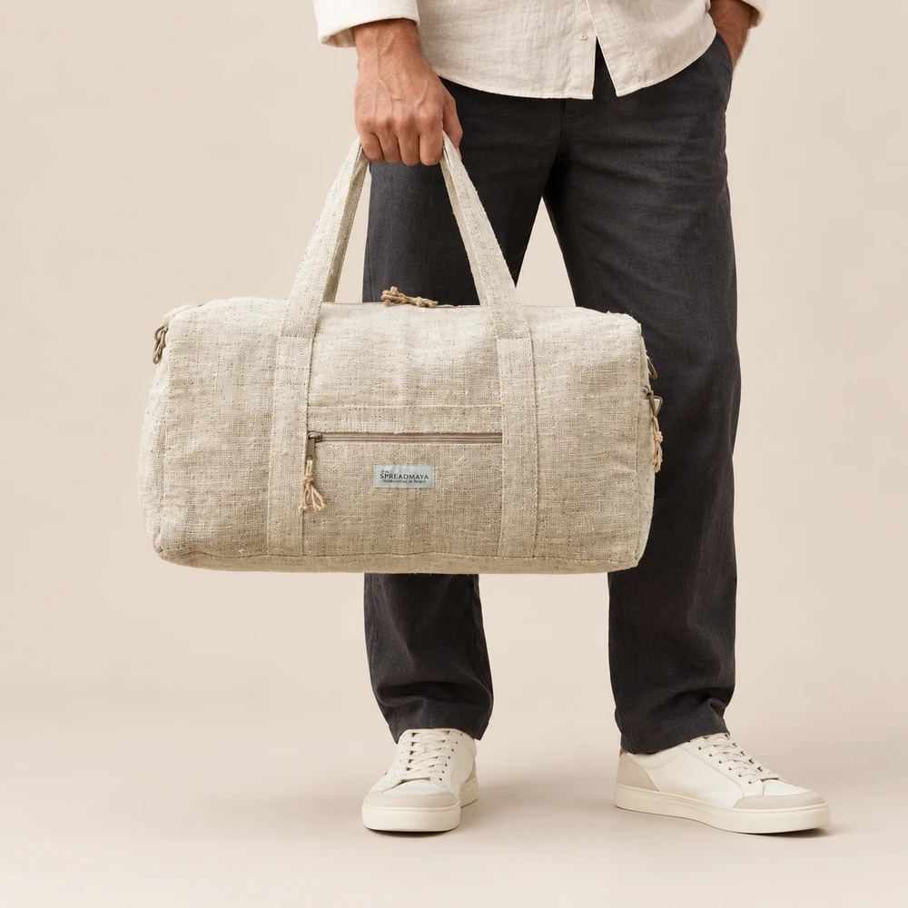 man holding a natural hemp duffle bag by its carry handles