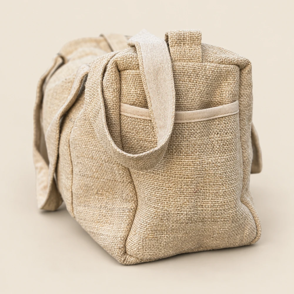 side view of the natural hemp duffle bag showing its open slip pocket