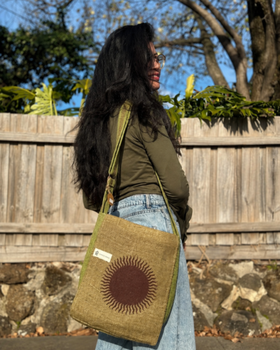 sun print hemp side bag green carryied by a woman