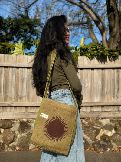 sun print hemp side bag green carryied by a woman
