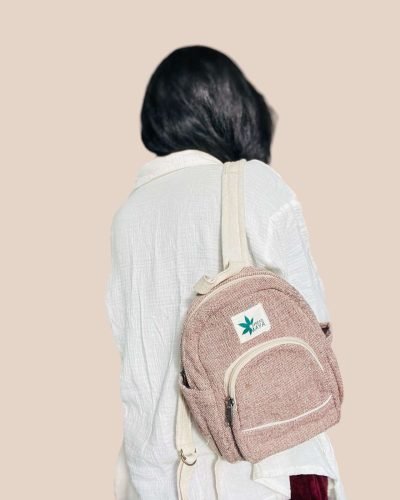Person carrying a mini hemp backpack
