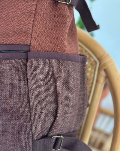 side pocket of brown roll top hemp backpack