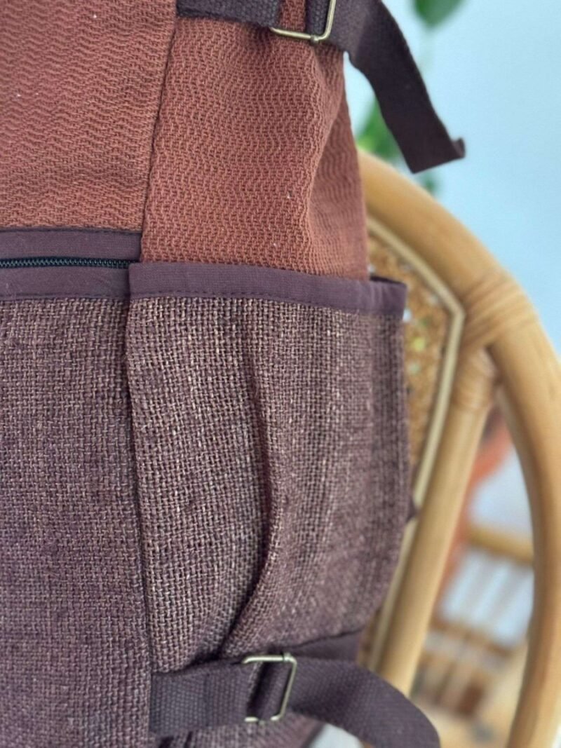 side pocket of brown roll top hemp backpack