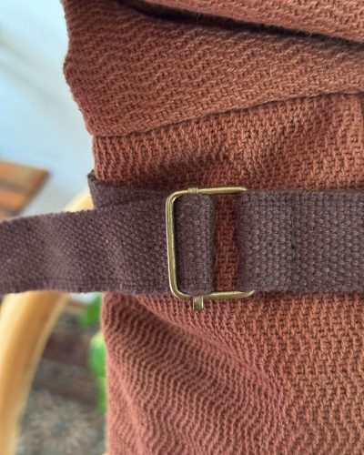 adjustable buckle of brown roll top hemp backapck
