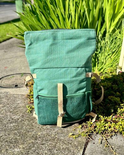 opened green color roll top hemp backpack