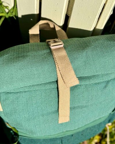 top view of roll top green large hemp backpack