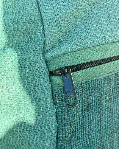 zoomed view of roll top large hemp backpack zipper