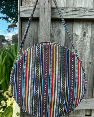 back view of blue patterned shamanic drum bag