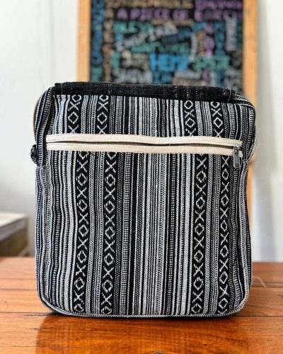 back view of black and white side bag flap