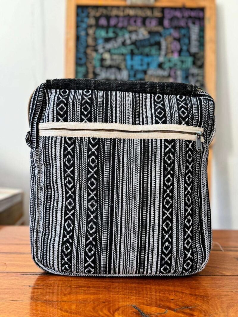 back view of black and white side bag flap