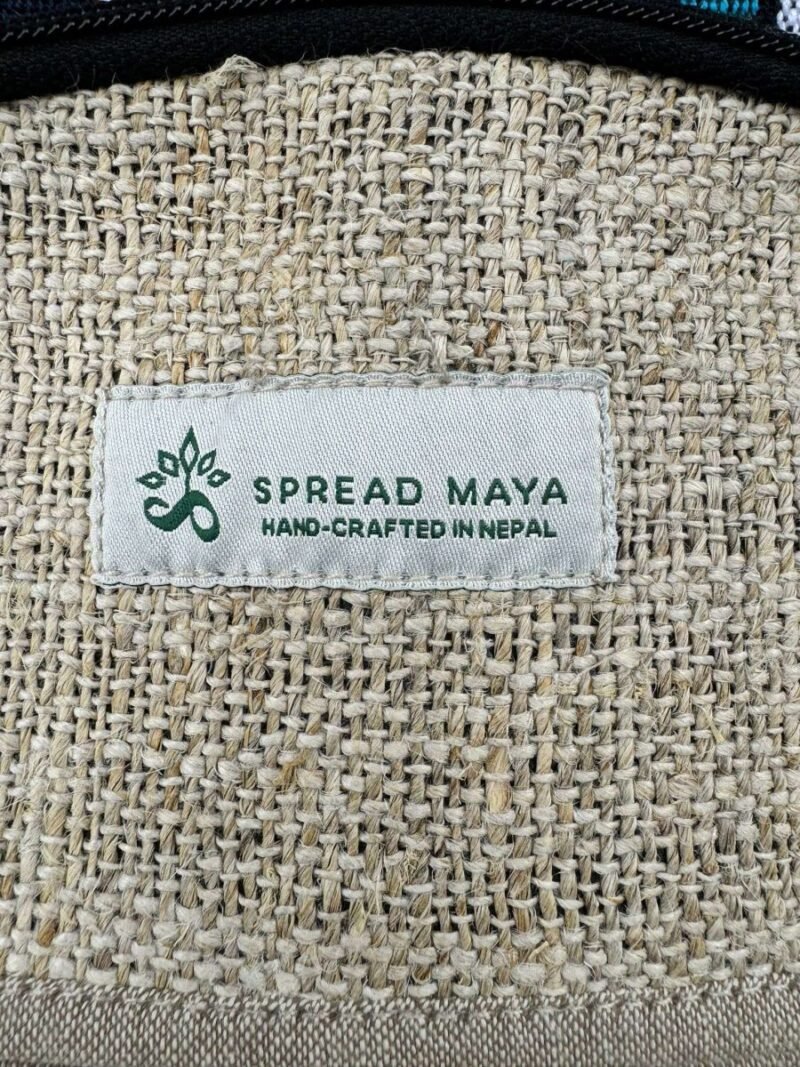 logo of spread maya stitched in a bag