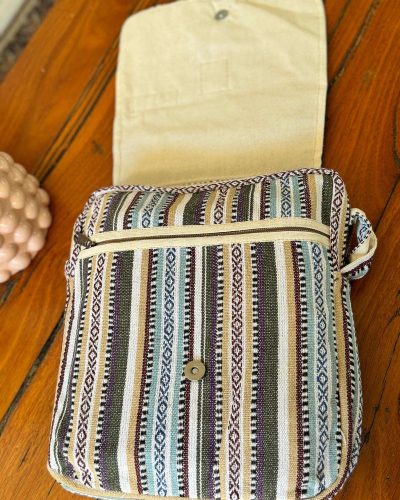 opened flap of white mix hemp side bag