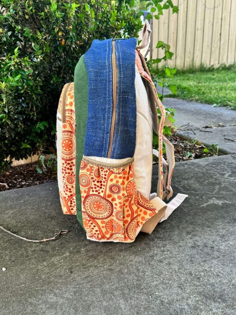 side view of koori backpack with green, blue and orange color