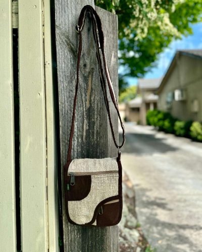 beige brown curvy flap side bag hanging