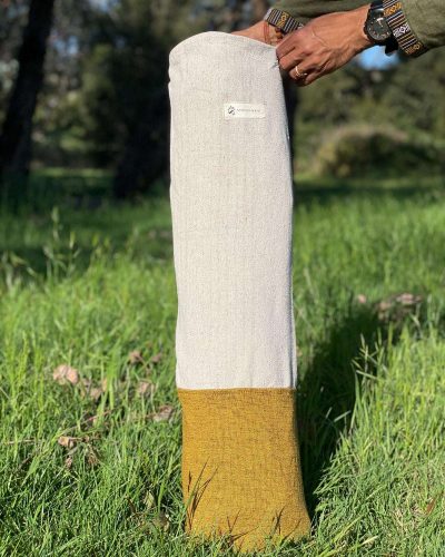 half yellow yoga mat cover on ground