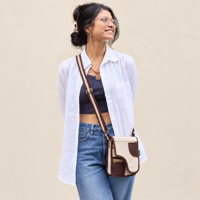 Woman wearing himlayan earthside hemp side bag with a white shirt and jeans