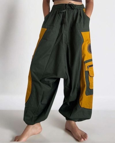 model wearing a Green baggy cotton trouser, Hand-stitched in Nepal