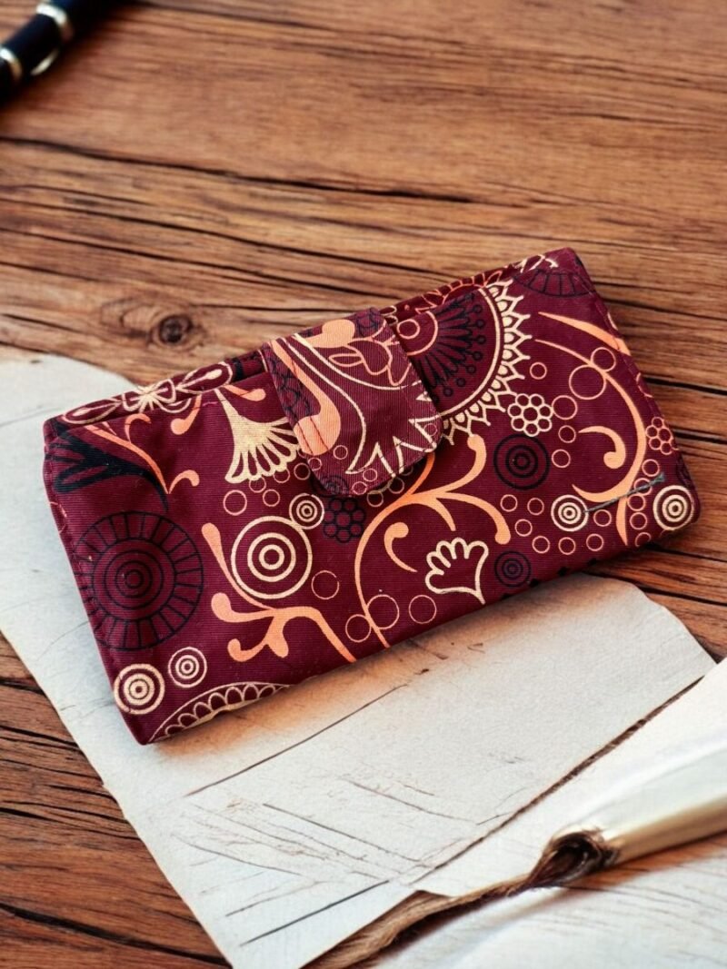 maroon artisan bliss wallet in a table