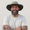 A man wearing green wide brim sun hats for men by spread maya