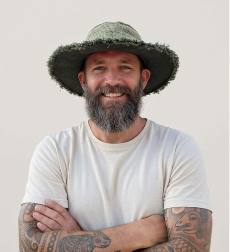 A man wearing green wide brim sun hats for men by spread maya