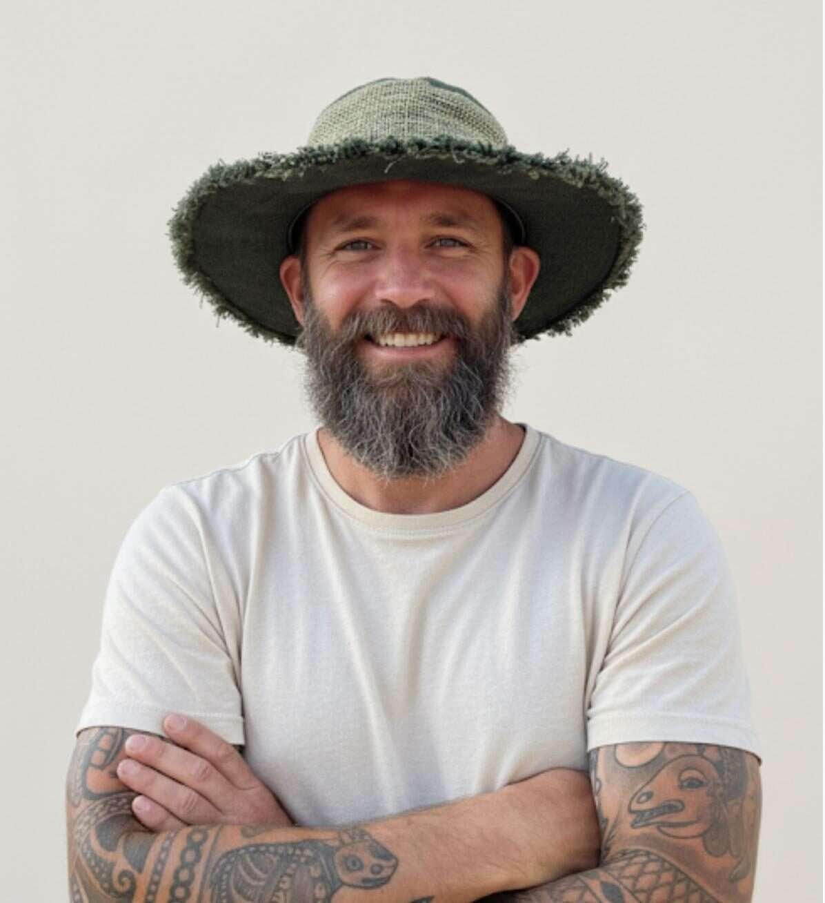 A man wearing green wide brim sun hats for men by spread maya