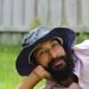 A man wearing navy blue hemp hat