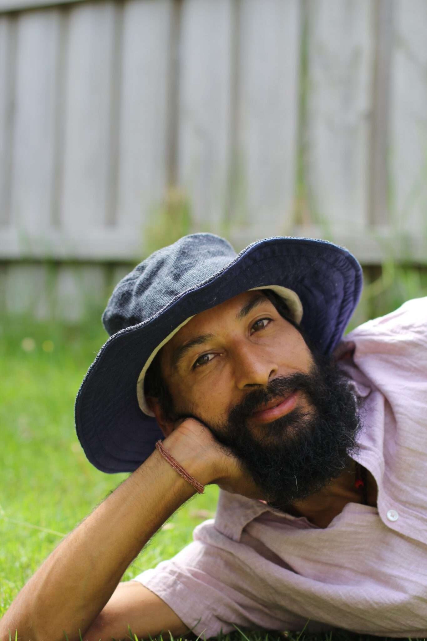 A man wearing navy blue hemp hat