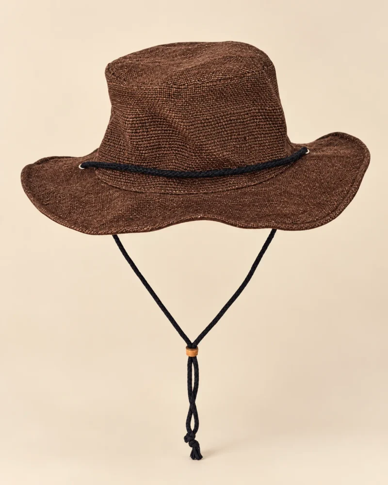 Brown KTM Safari Hat with Chin String handmade from Himalayan hemp, featuring a shapable wide brim, textured crown and black chin cord with wooden adjuster.