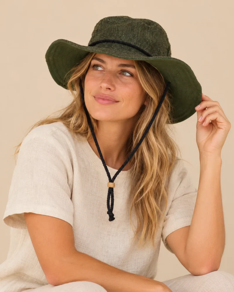 a woman wearing Green KTM safari hat with chin string