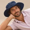 KTM safari hat worn by male and looking at the camera