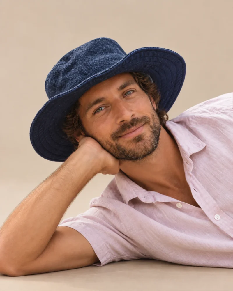 KTM safari hat worn by male and looking at the camera
