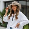 a woman posing with beige colored hemp cruiser hat with string