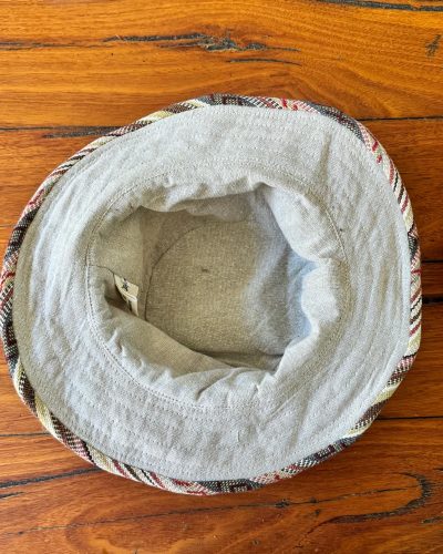 inner view of bordered hemp sun hat in beige