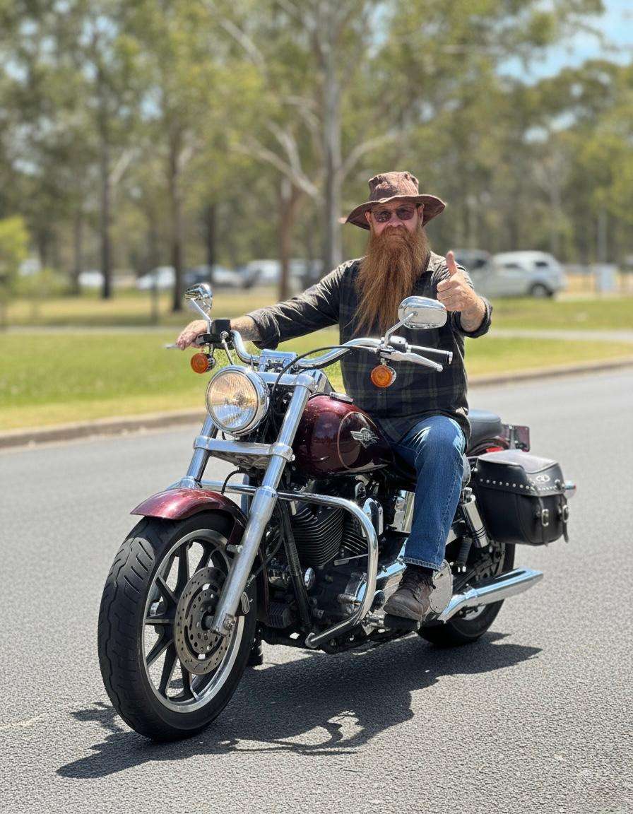 A man posing in bike wearing brown hemp hat