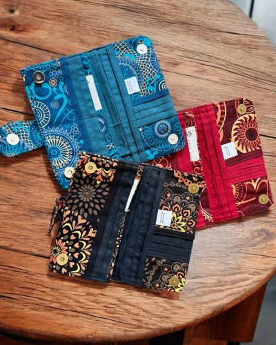 inner side of blue, black and maroon cotton wallet for women