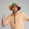a man posing with rainbow string hemp hat